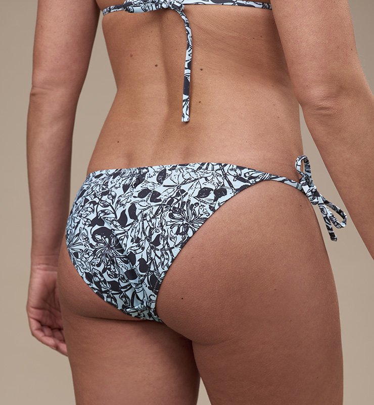 Eco bikini briefs with flower patterned bow in ECONYL® regenerated nylon 